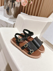 FLAT SANDALS IN BLACK TRIOMPHE EMBOSSED SMOOTH CALFSKIN