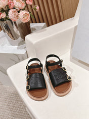 FLAT SANDALS IN BLACK TRIOMPHE EMBOSSED SMOOTH CALFSKIN