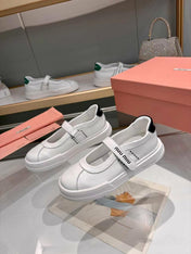 MIUMIU 26S MARY JANE BALLERINAS IN WHITE AND BLACK CALFSKIN