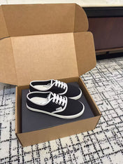 PRADA 26S LACE UP SNEAKERS IN BLACK AND WHITE CANVAS