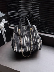 CHANEL 26S SHOPPING TOTE 36 IN BLACK WITH WHITE VERTICAL-STRIPED TWEED