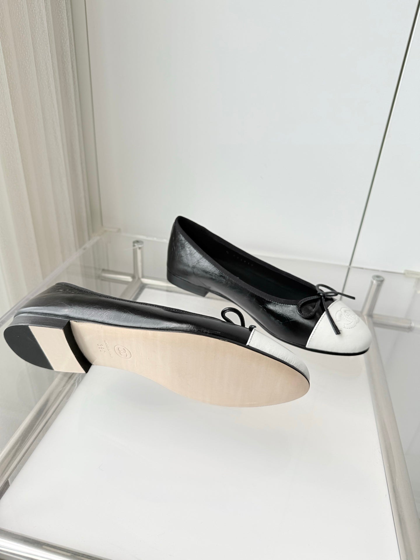 CHANEL 26S BALLET FLATS IN BLACK CRACKED CALFSKIN WITH WHITE TOE CAP AND BOW
