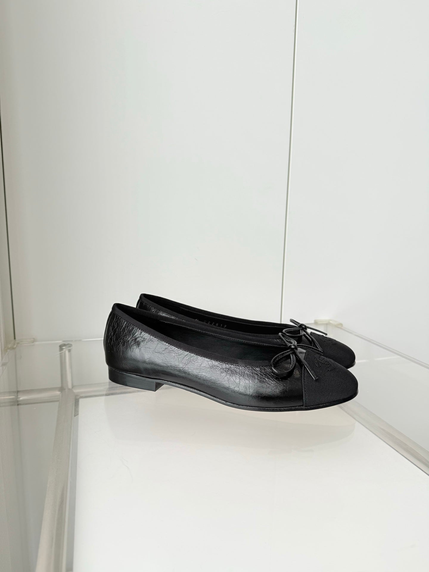 CHANEL 26S BALLET FLATS IN BLACK CALFSKIN WITH FABRIC TOE CAP AND BOW