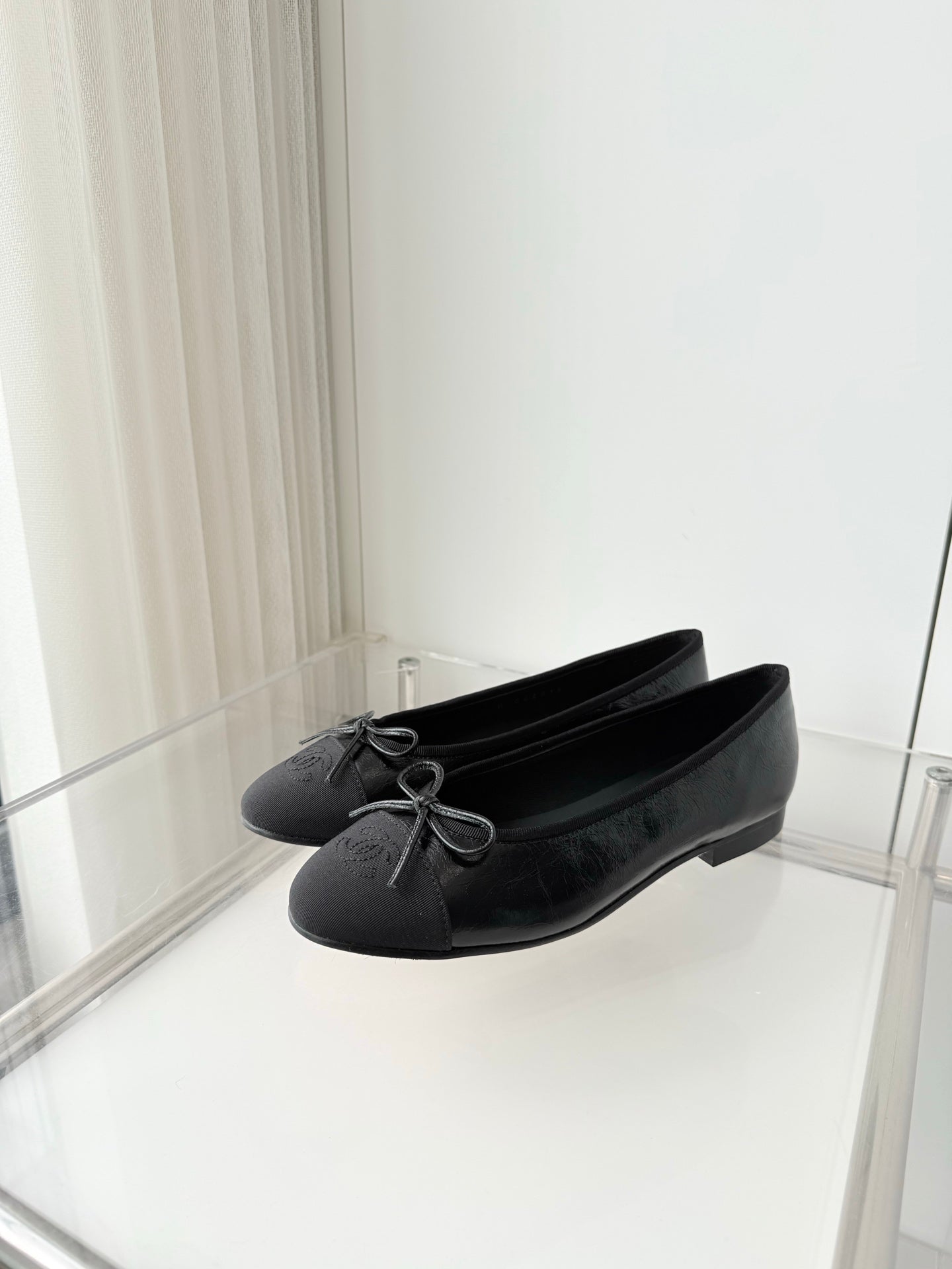 CHANEL 26S BALLET FLATS IN BLACK CALFSKIN WITH FABRIC TOE CAP AND BOW