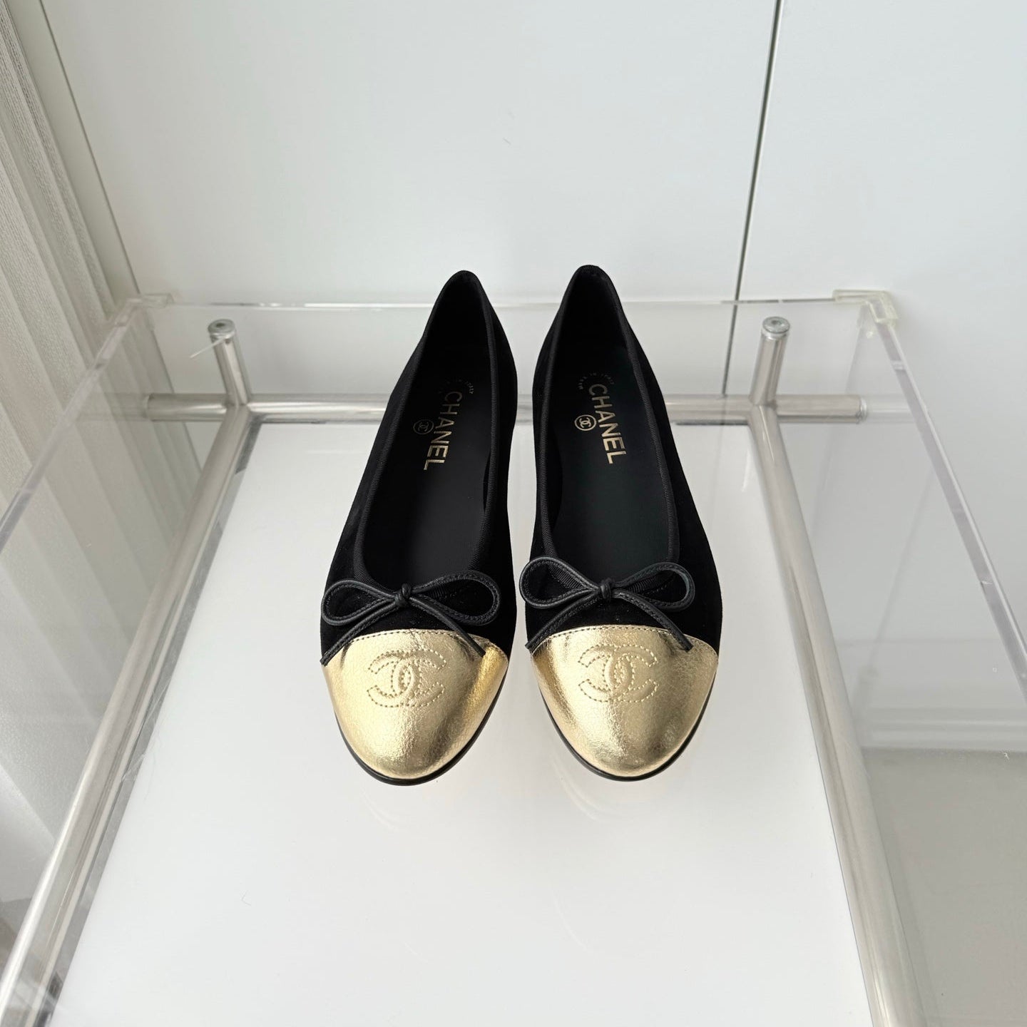 CHANEL 26S BALLET FLATS IN BLACK SUEDE WITH GOLD TOE CAP AND BOW