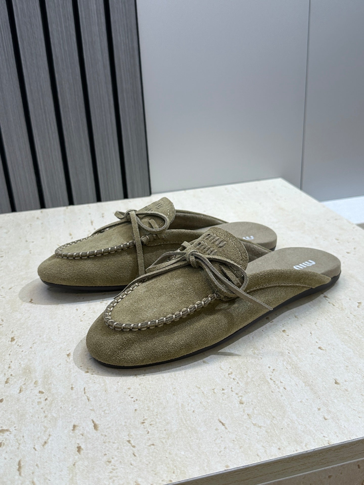 MIUMIU 26S SNEAKER MULES IN DARK OLIVE GREEN SUEDE WITH BOW