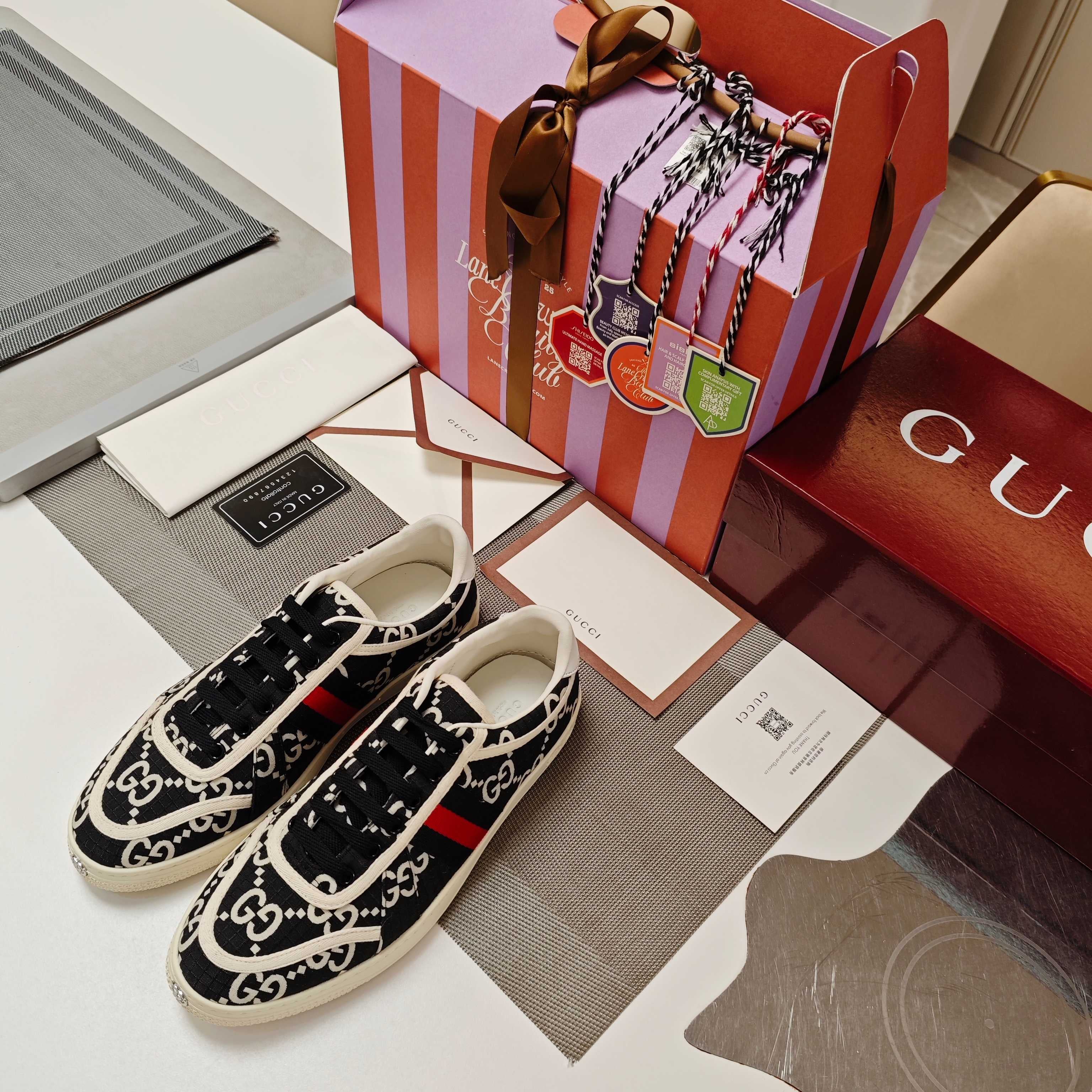 GUCCI 26S GG WEB SNEAKERS IN BLACK AND WHITE GG CANVAS