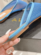 ALAIA FLAT MULES IN CERULEAN BLUE MESH FISHNET