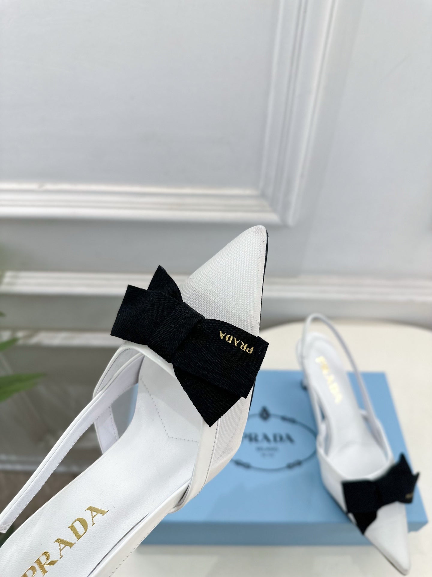 PRADA 26S POINTED-TOE SLINGBACK HEELS 75MM IN WHITE MESH WITH BLACK BOW