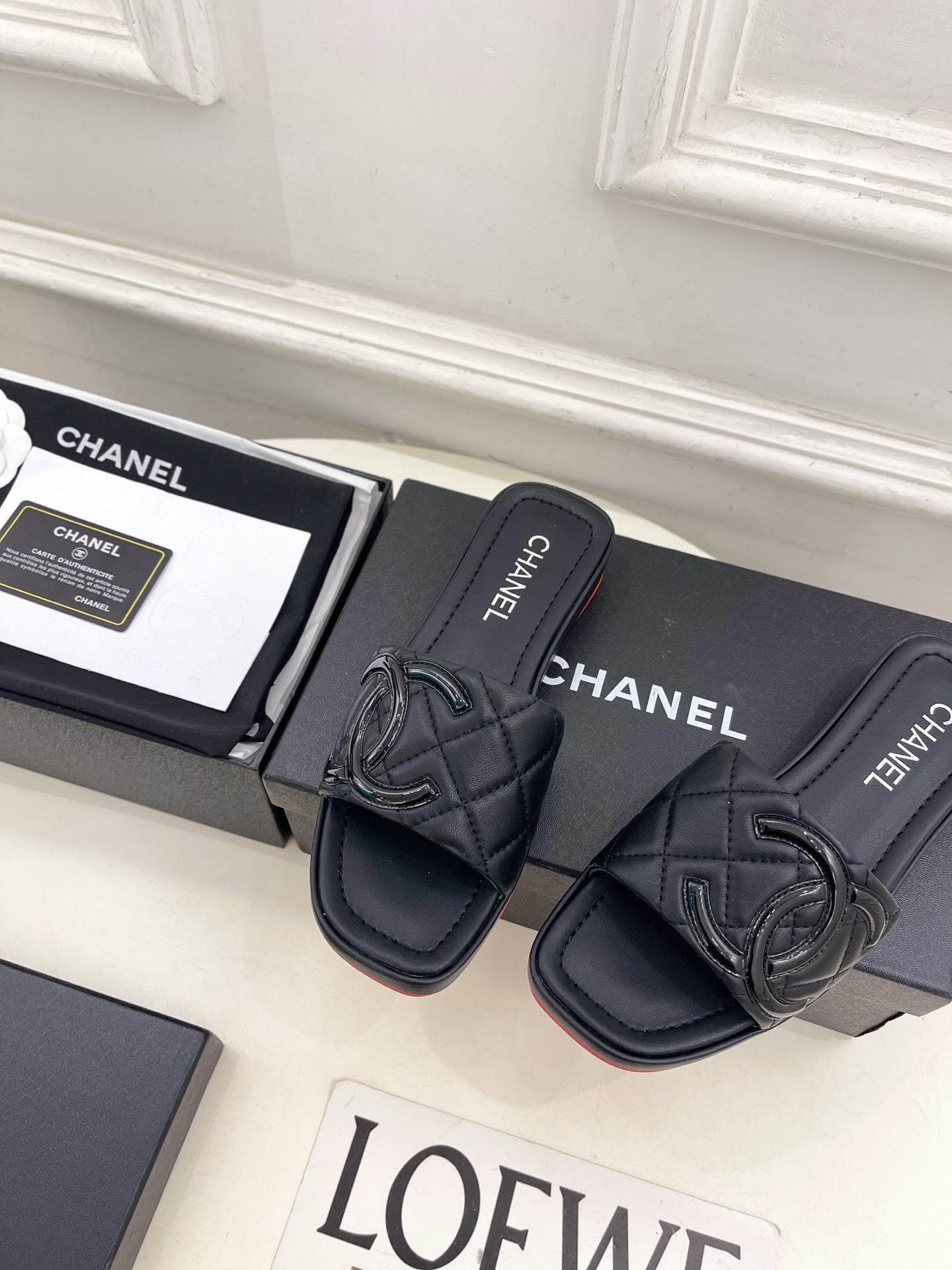 CHANEL 26S FLAT SLIDES IN BLACK LAMBSKIN WITH CC LOGO