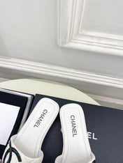 CHANEL 26S FLAT SLIDES IN WHITE LAMBSKIN WITH BLACK CC LOGO
