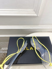 ALAIA 26S POINTED-TOE THONG SANDALS IN YELLOW AND TRANSPARENT PVC
