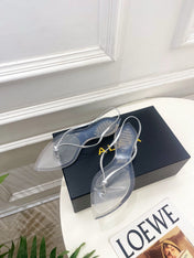 ALAIA 26S POINTED-TOE THONG SANDALS IN SILVER AND TRANSPARENT PVC