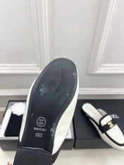 CHANEL 26S MULES IN WHITE LAMBSKIN AND BLACK FABRIC