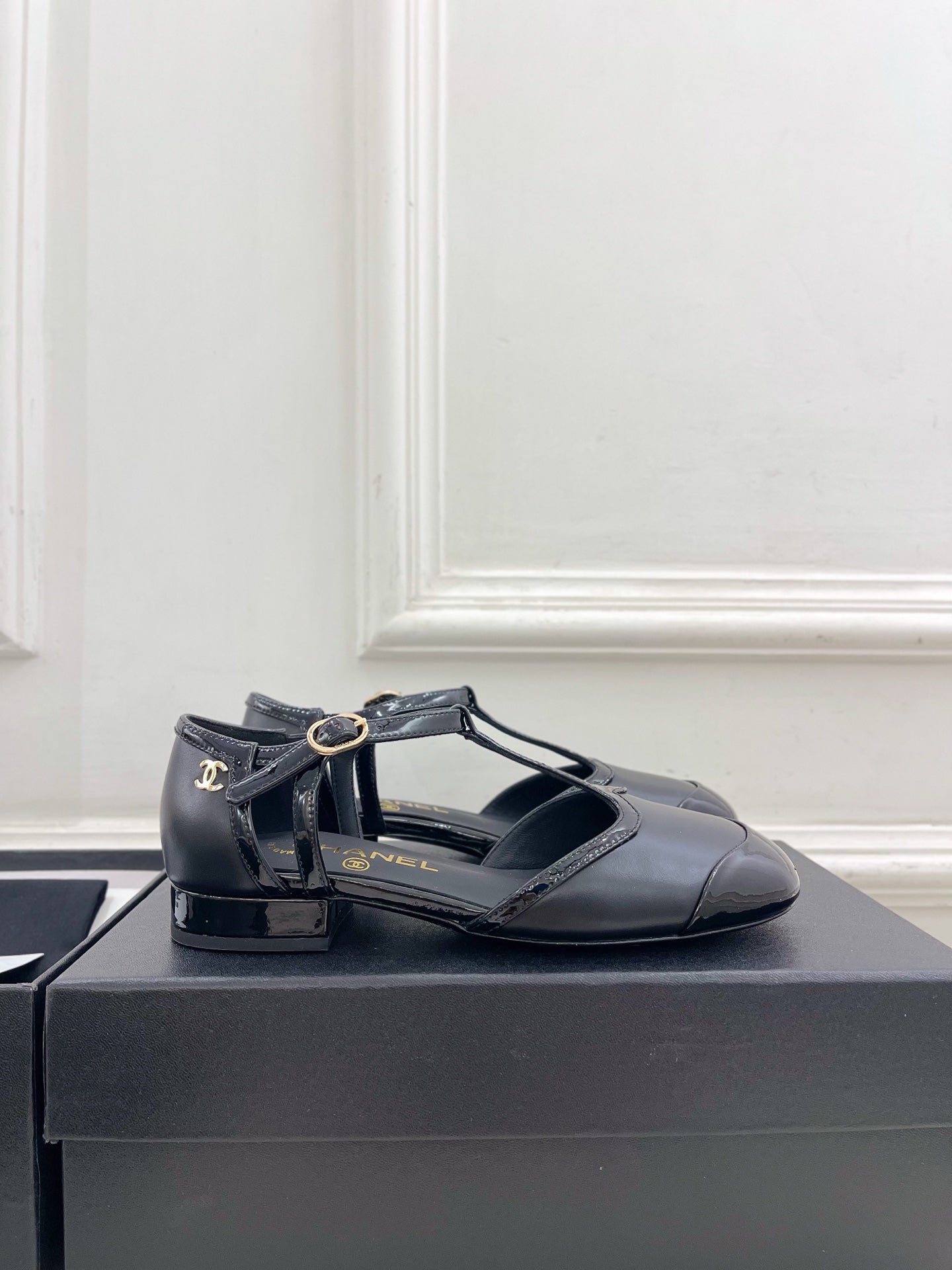 CHANEL 26S T STRAP MARY JANES IN BLACK PATENT AND LAMBSKIN