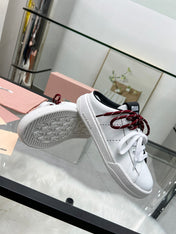 SNEAKER MULES IN BLACK AND WHITE CALFSKIN WHITE RED LACES